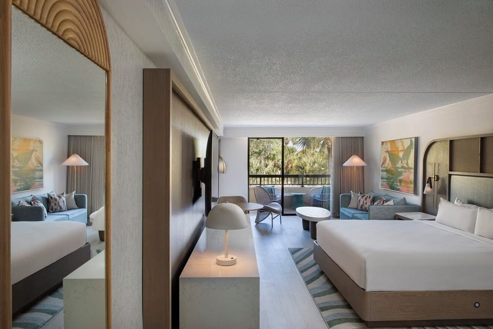 Unwind in a spacious suite with serene balcony views.