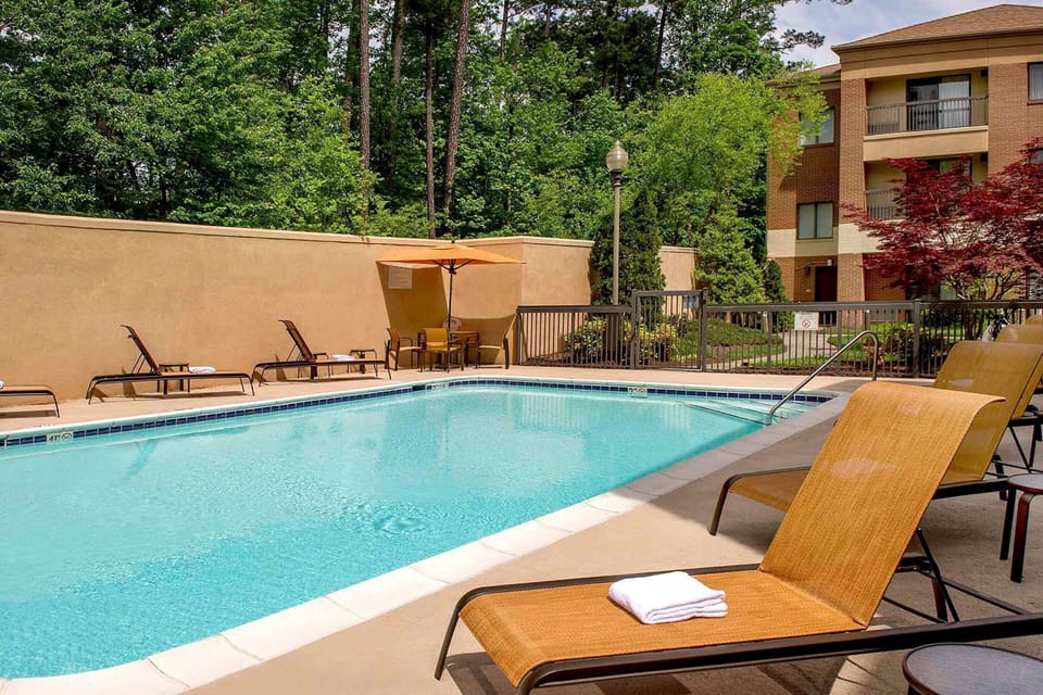 Soak up sunshine poolside on loungers beside sparkling water.