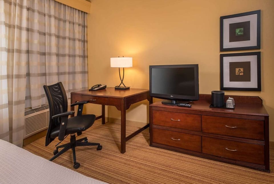 Stay productive at the spacious desk with in-room entertainment.