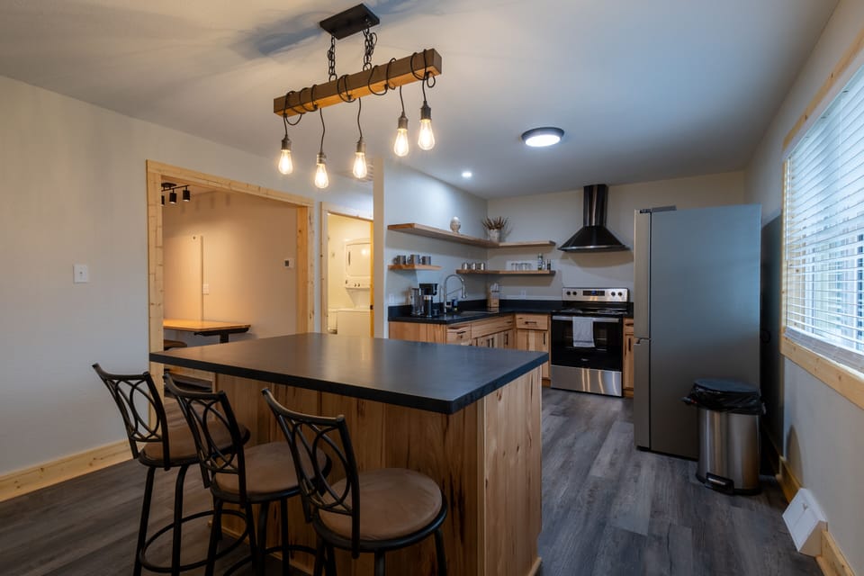 Eat in kitchen seats 3. Use height adjustable sewing chairs to seat 6!