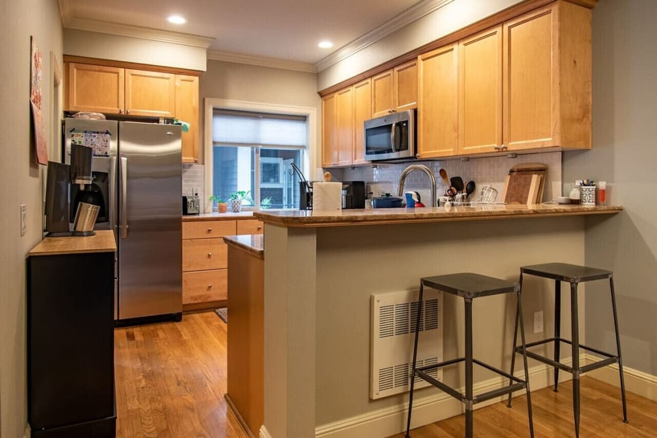 Sit back and relax on some bar stools while your friends/family cook in the kitchen!  Plenty of counter space to enjoy.