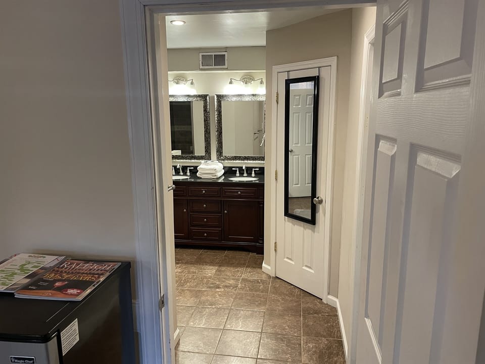 View of the lower suite WiC, vanity, and laundry area all for guests private use.