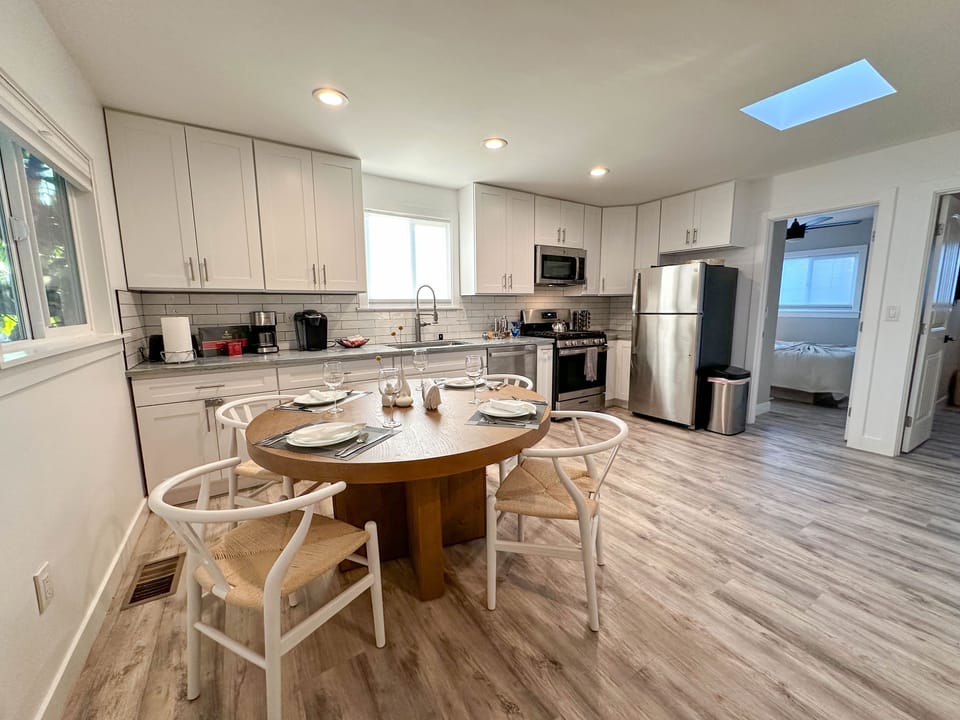 Gather around the table and savor delicious meals in our stylish kitchen/dining area.