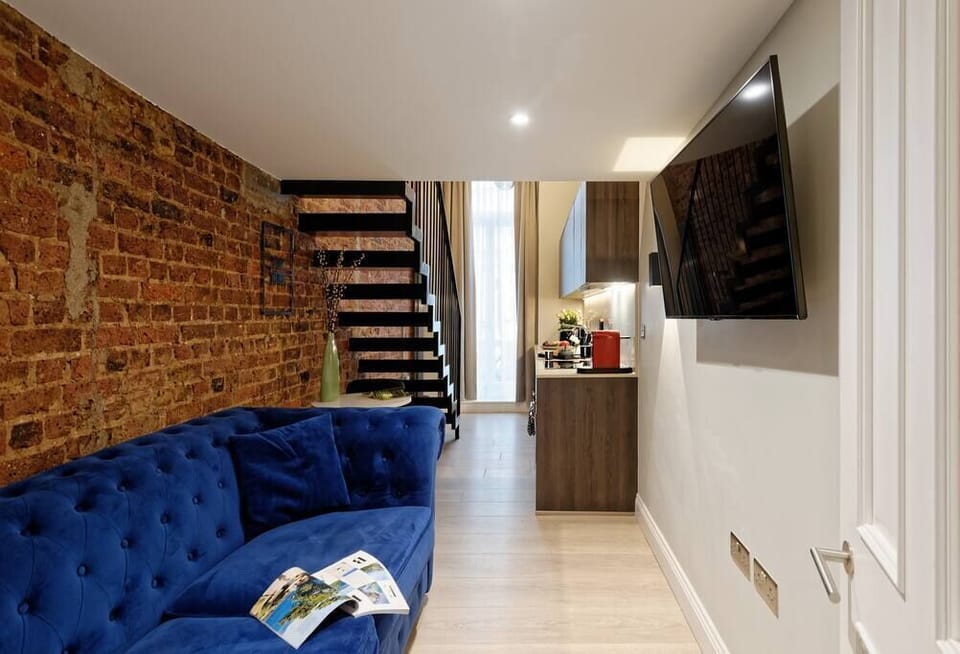 Living room area with comfortable sofa and TV.