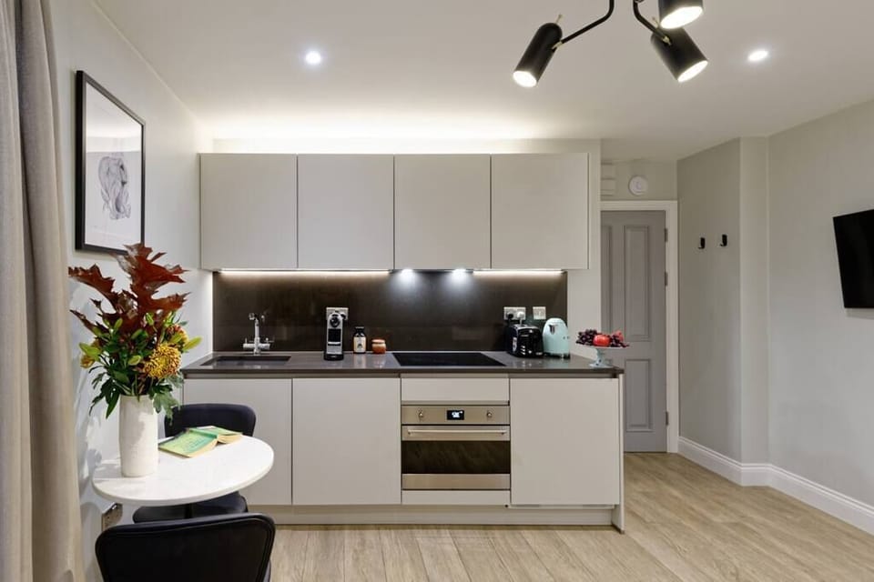 Open space with private kitchen area fully equipped with oven-microwave, stove, kettle, toaster, Nespresso coffee machine, and kitchenware. Salt and pepper included. Non-included oils or food. Plus free access to a laundry room.