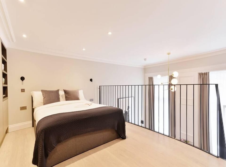 On the top floor you will find a comfortable double bed, and a huge wardrobe + a second smart TV.