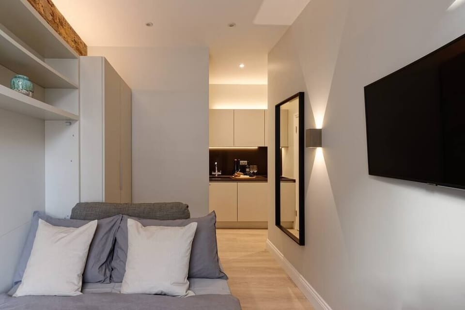 Comfortable double bed. Please, note that the bed will be open and ready for your arrival. It's a wall bed, with the newest technology available. Super convenient and space-efficient!