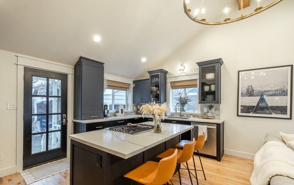 Fully equipped kitchen with modern appliances and bar seating.
