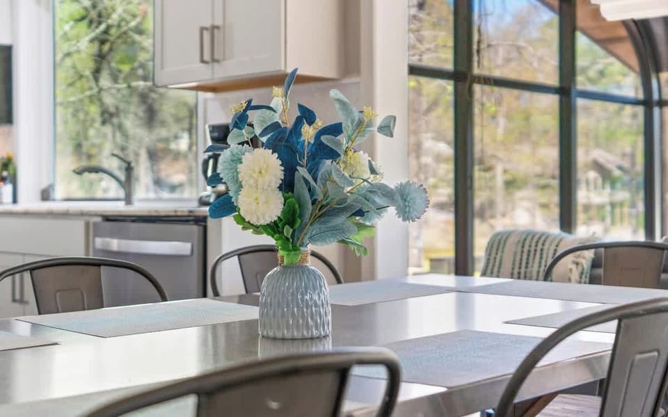  Elegant dining setup with natural light and peaceful views.