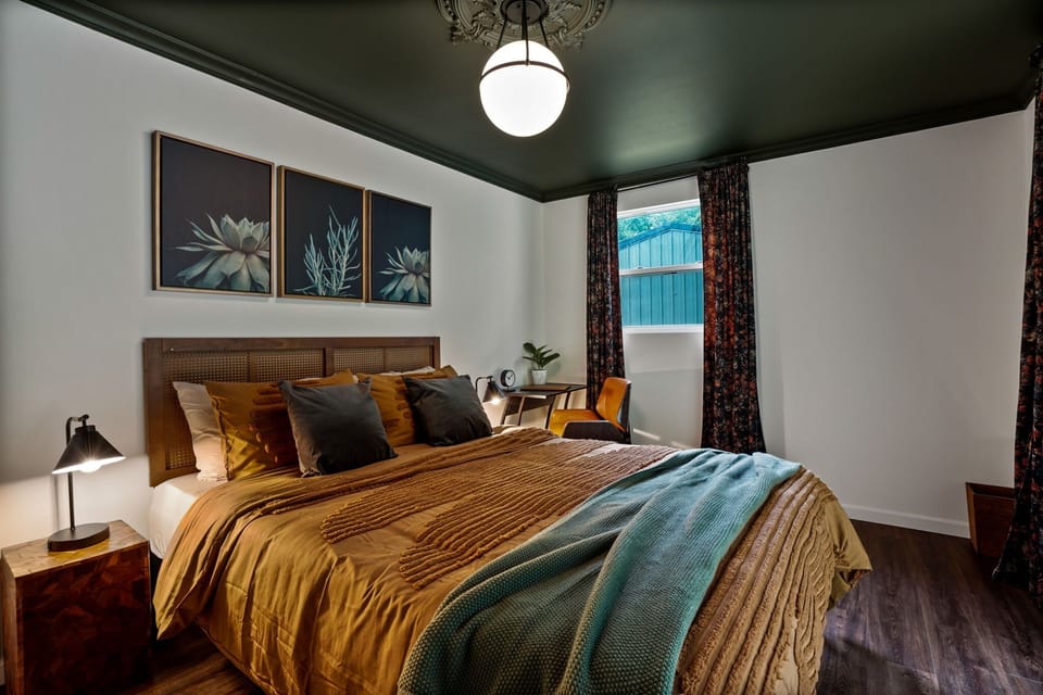 Bedroom 2 with queen bed and walkout access to backyard