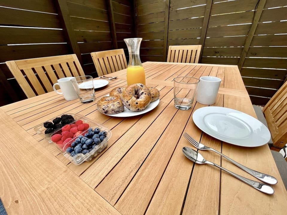 Private patio with outdoor table seating -- a perfect spot to sip your morning coffee or unwind with evening drinks while enjoying fresh coastal air.