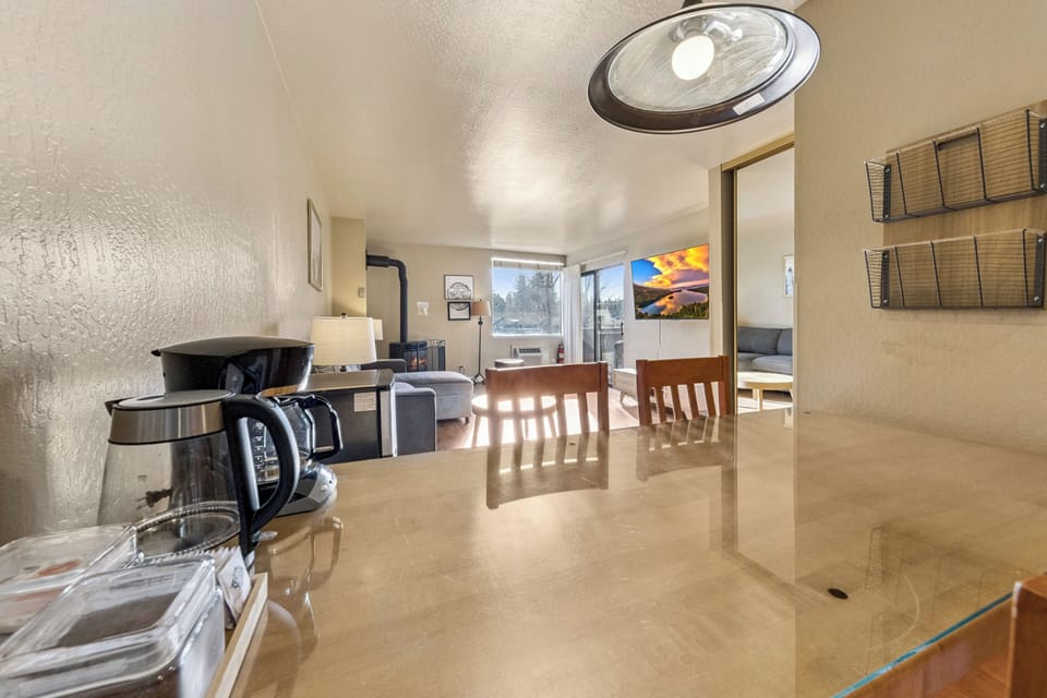 Unwind in your bright, open living space with cozy seating and modern amenities, perfectly designed for relaxing after exploring the area.