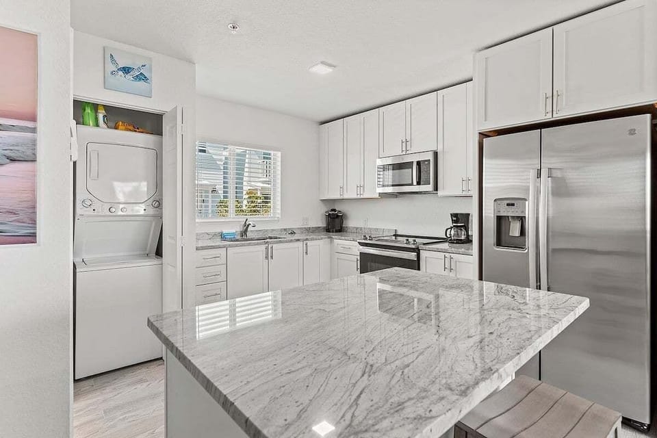 The fully equipped kitchen at Sea Breeze features granite countertops and everything needed for easy meal preparation during your Marathon FL Florida Keys vacation.