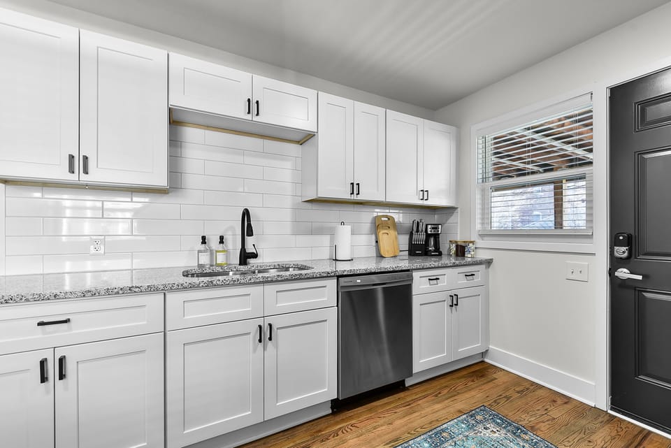 Prepare delicious meals in your fully equipped kitchen featuring modern appliances and granite countertops.