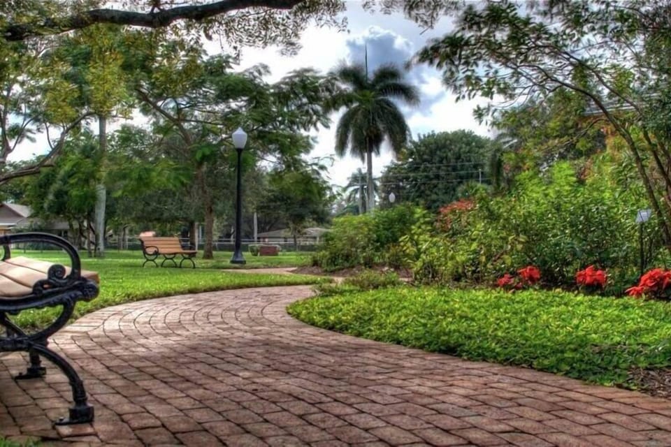 Stroll shaded garden paths and breathe in tropical calm.