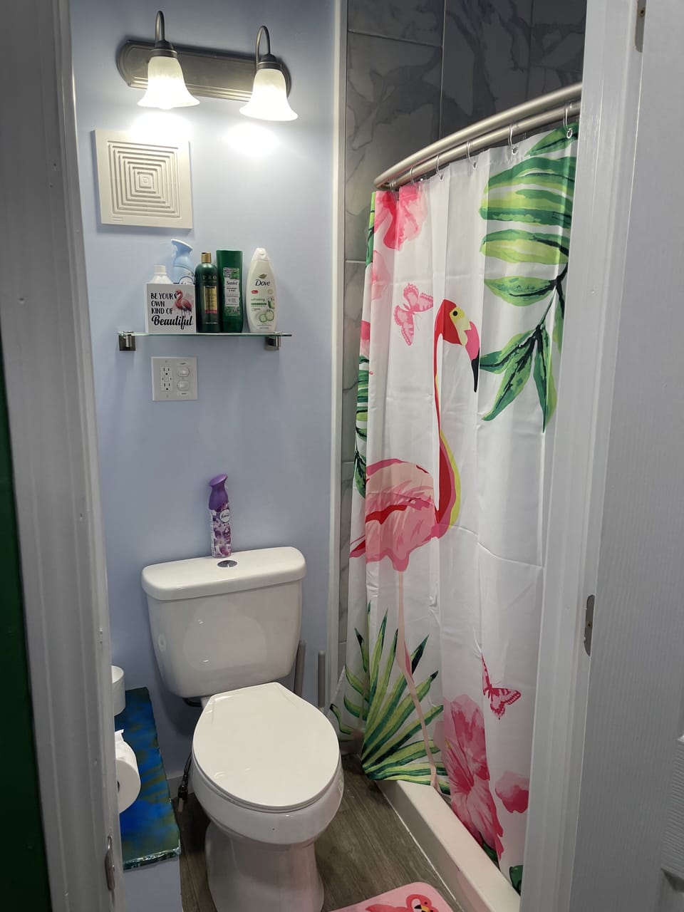Bathroom has a shower and toilet