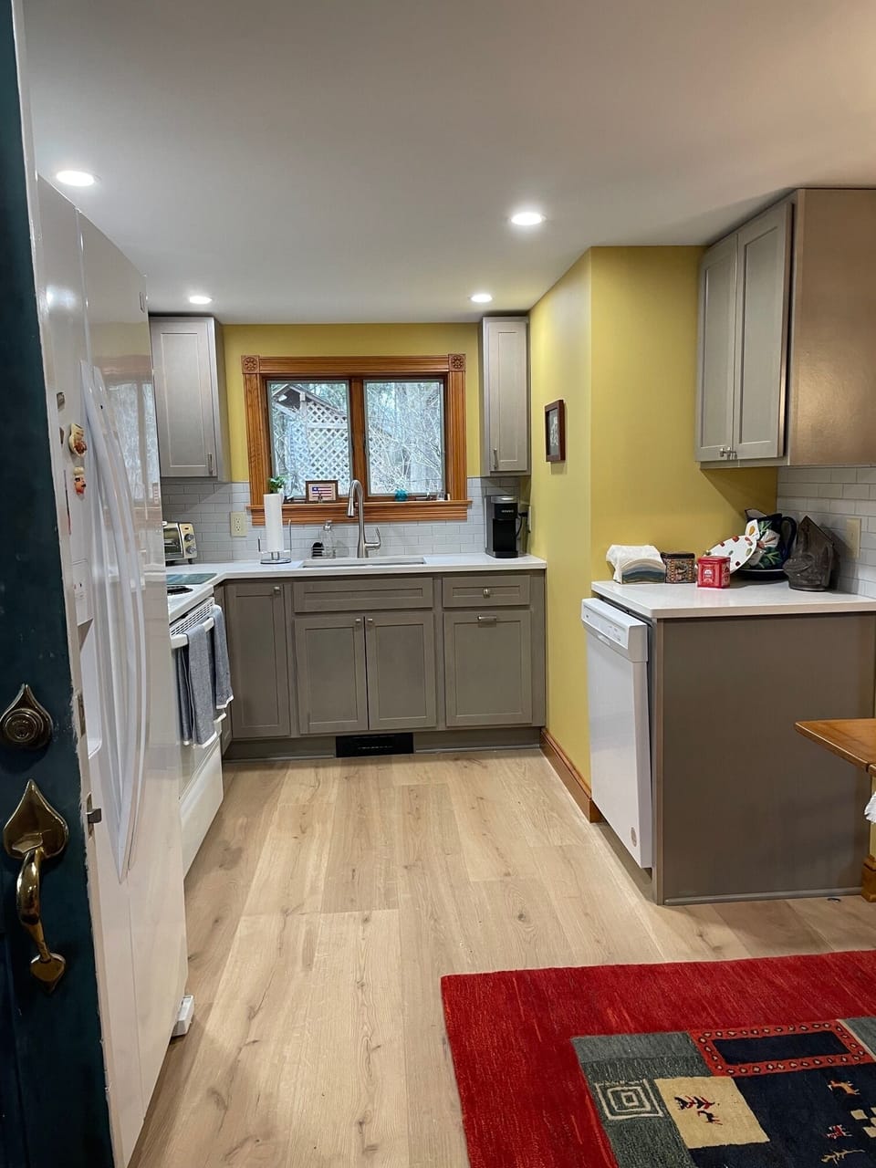 new kitchen with dishwasher, oven, toaster oven, ice maker in fridge