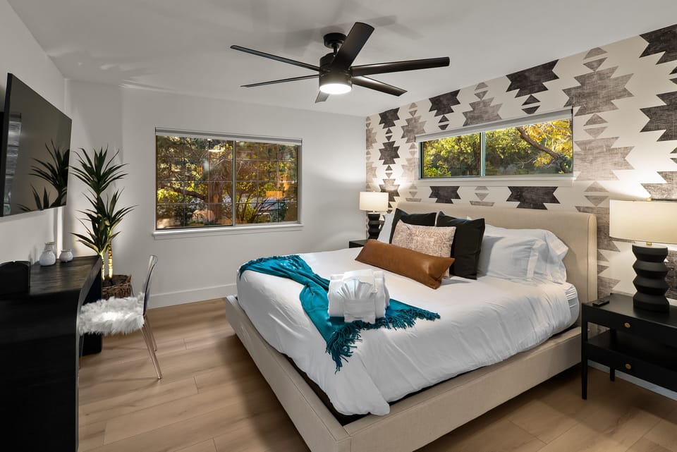 Bedroom 2 of the listing with ensuite bathroom. King bed