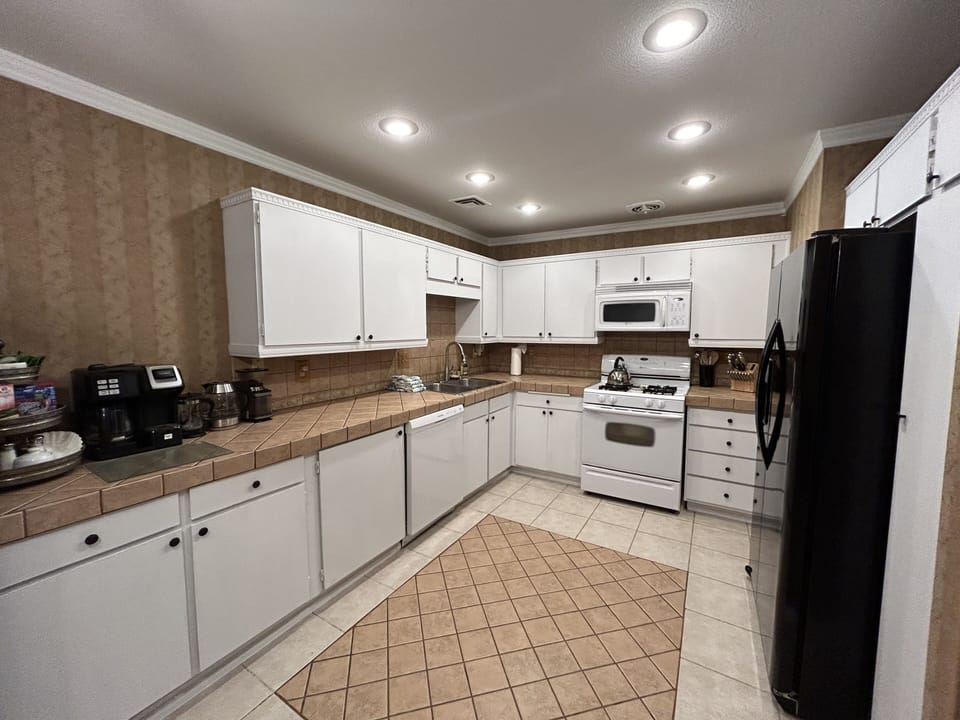Lots of Prep Space in this open Kitchen Recessed Lights also has Coffee/Tea Bar 