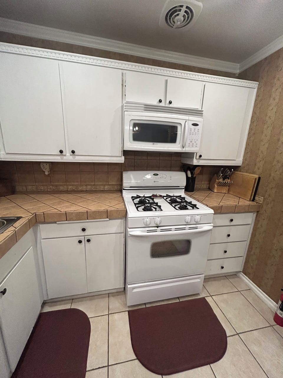 Kitchen microwave and gas stove 
