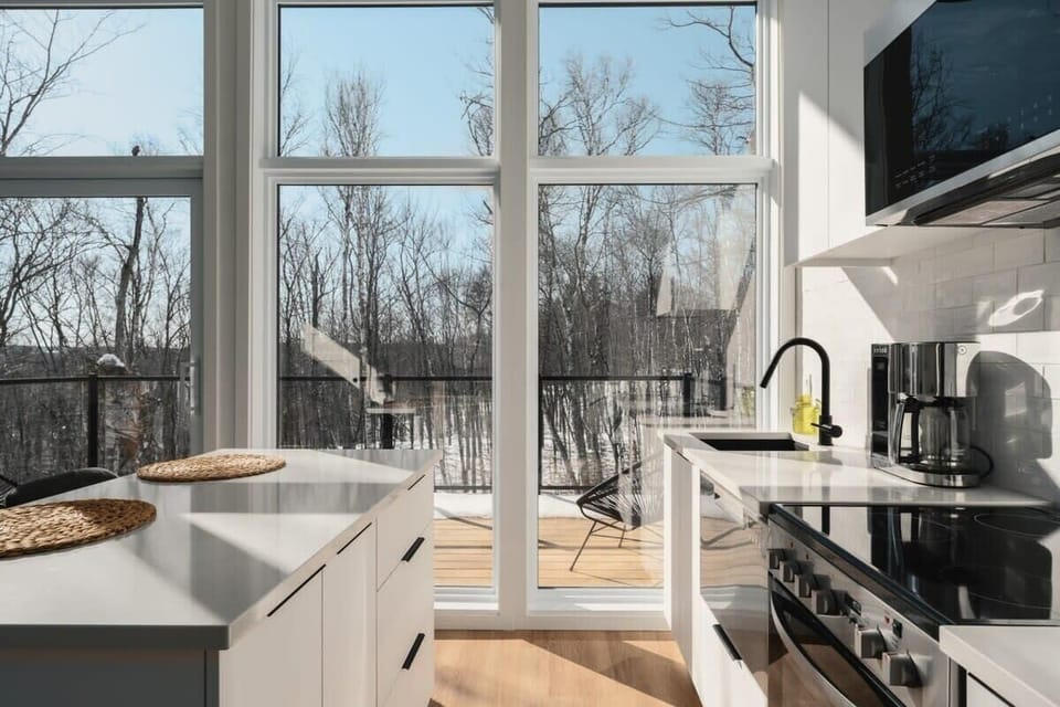 From the kitchen, enjoy the view of nature through the windows.