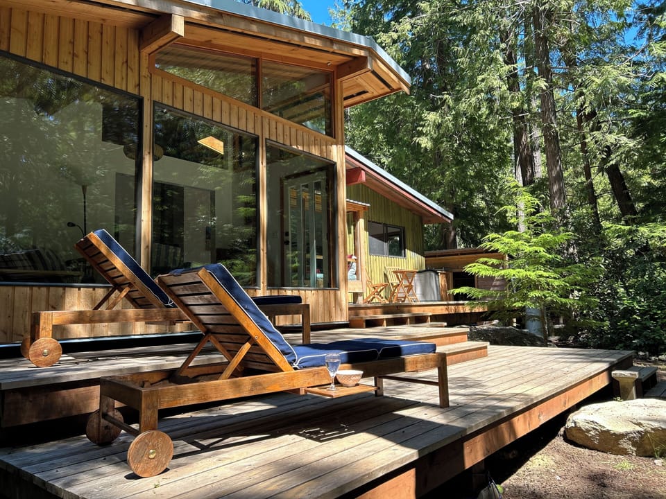 Sun exposed deck with 2 teak sun loungers to relax and enjoy a cold drink. 