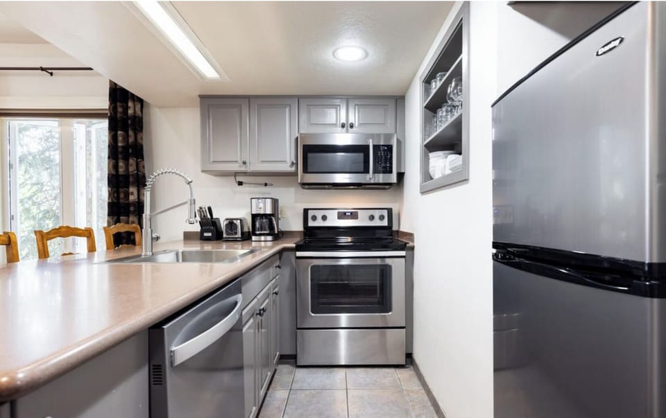 Modern range, microwave, dishwasher, and refrigerator