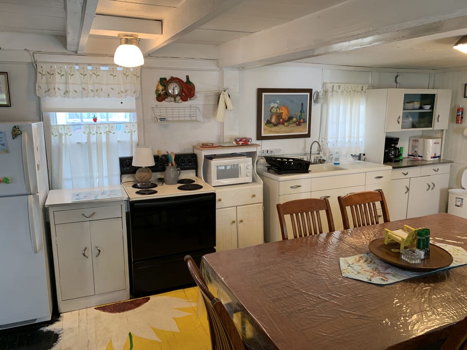 Dinning room with pots and pan and plate and silverware
