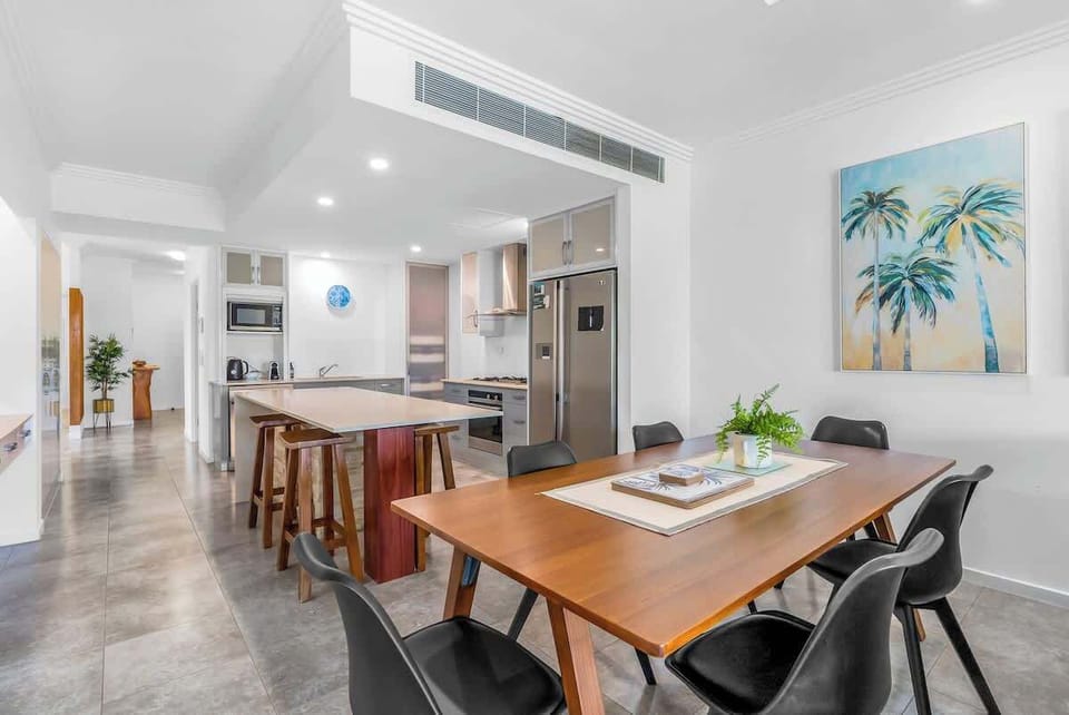 Savour your meals in style, whether gathered around the dining area or seated at the convenient breakfast bar.