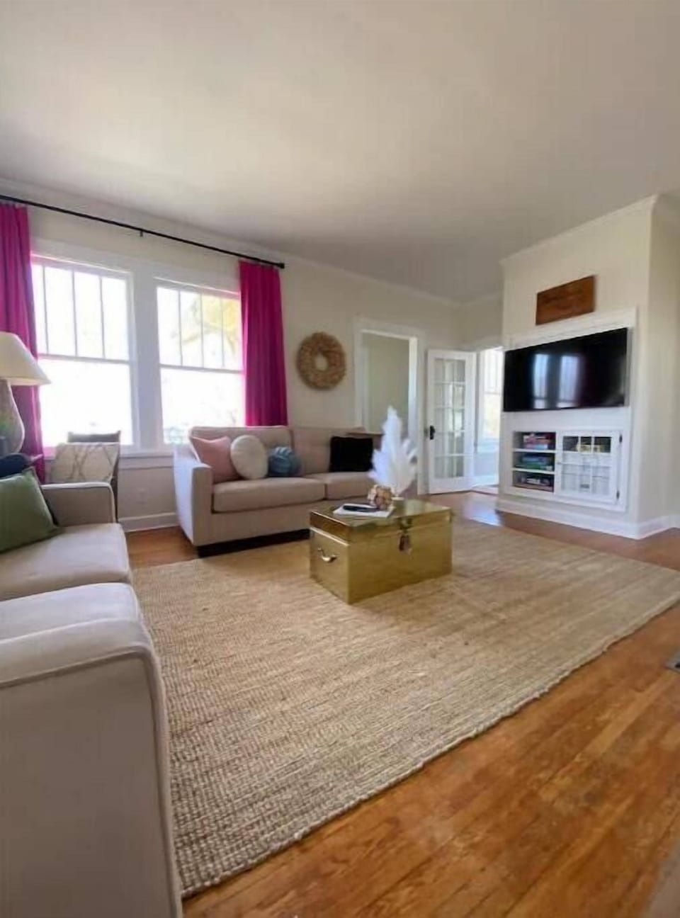 Large main floor living room connecting to the private work space & dining room.