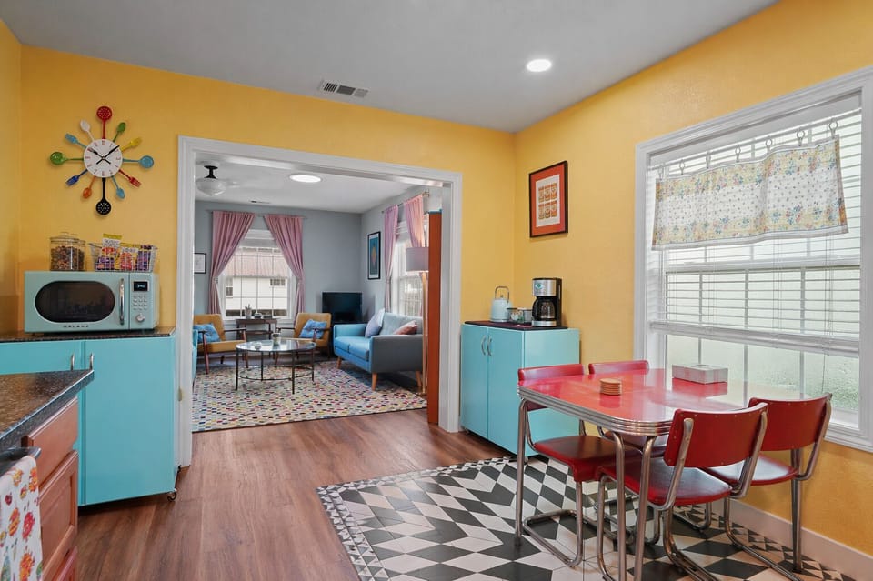 Enjoy meals in this cheerful vintage-inspired dining area, open to the cozy living room for easy gathering