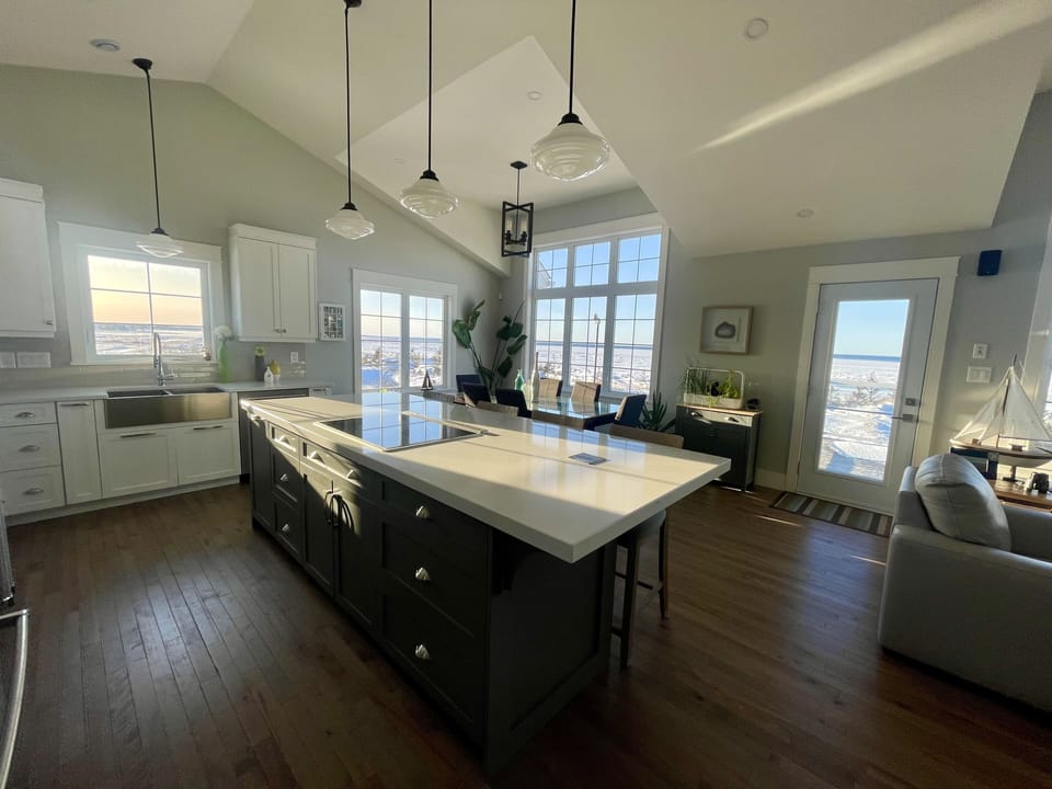 Open - living room, dining room and kitchen with 14' ceilings and wood floors. 