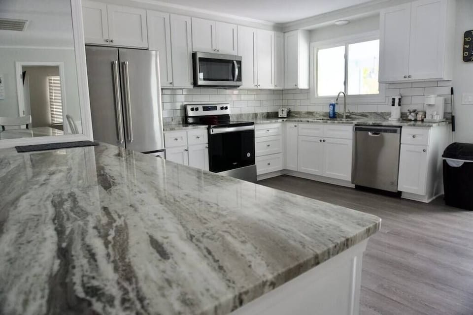 Beautiful open kitchen with new stainless-steel appliances