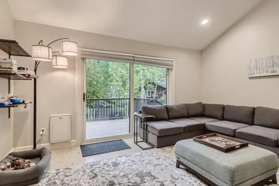 Living room opens to bright and sunny deck.