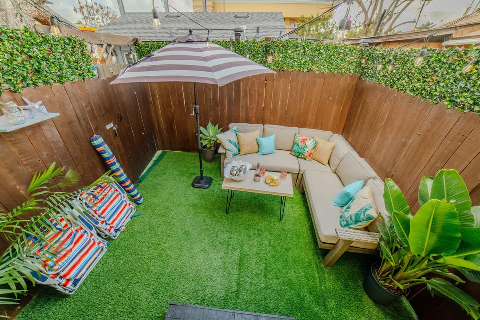 The outdoor patio is fenced for privacy.