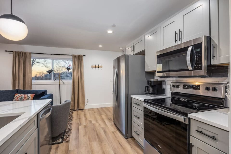 Fully-stocked, updated kitchen with all the supplies you could need to enjoy a meal at home.