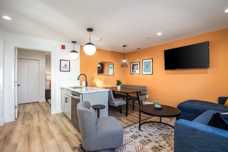 Living, kitchen, and dining spaces bring the perfect blend of homey comfort, charming color, and modern style.