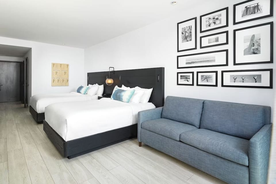 Stretch out together with two beds and cozy lounge seating.