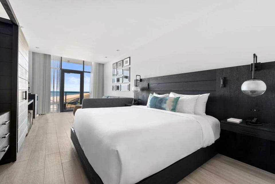 Wake up to ocean views from a serene, airy bedroom.