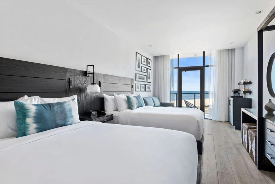 Stretch out in double beds with a dazzling ocean backdrop.