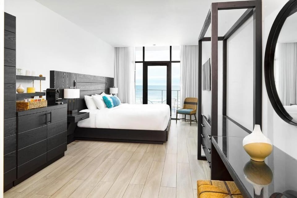 Breathe in ocean vistas from a bright, designer king retreat.