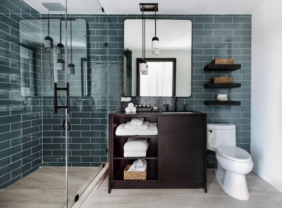 Refresh under the glass-enclosed shower with spa-like calm.