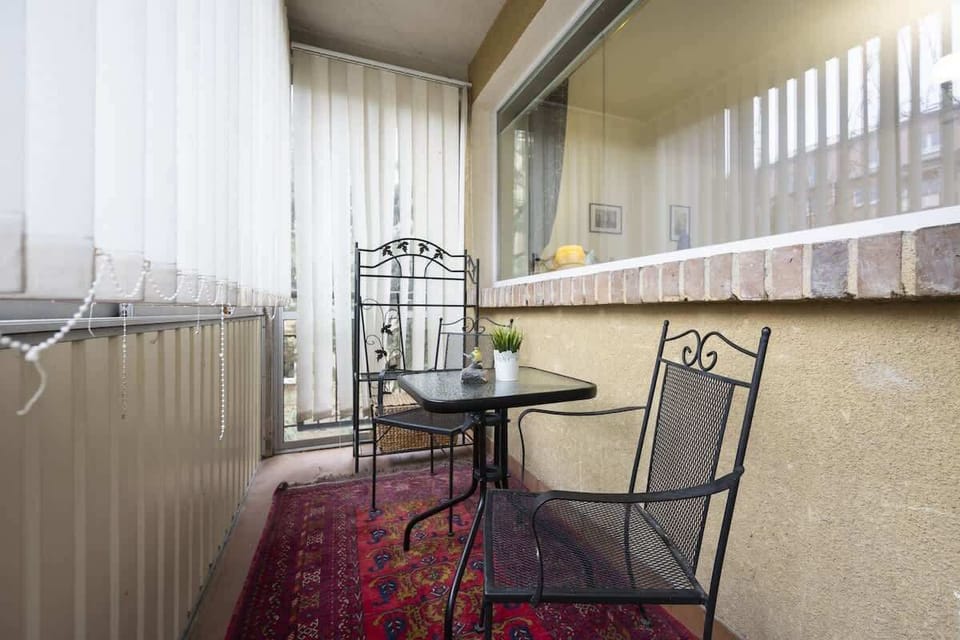 Balcony with garden furniture.