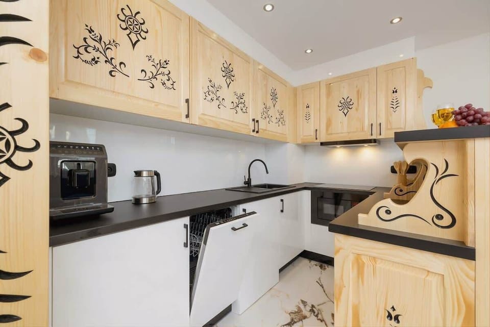 Fully equipped kitchenette with induction cooktop.