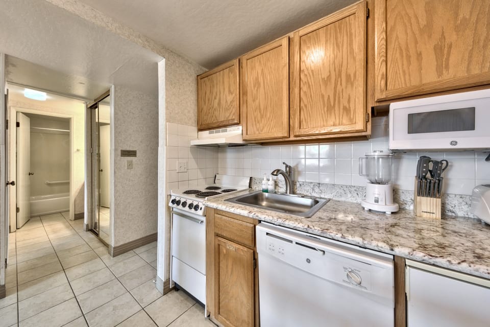 Your fully equipped kitchen features granite counters, oak cabinets, and all appliances needed for home-cooked meals during your stay.