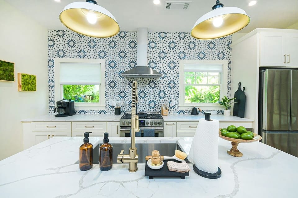 Modern cooking appliances and spacious quartz countertops, the kitchen has it all!
