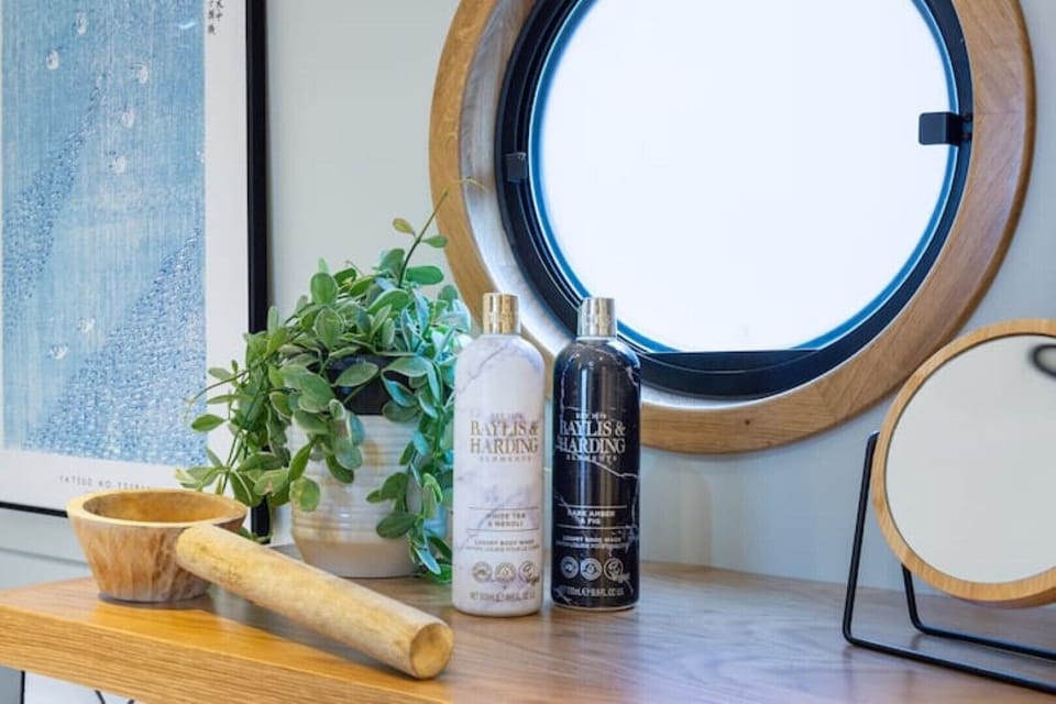 Hand soaps and body wash products are provided, alongside soft white towels