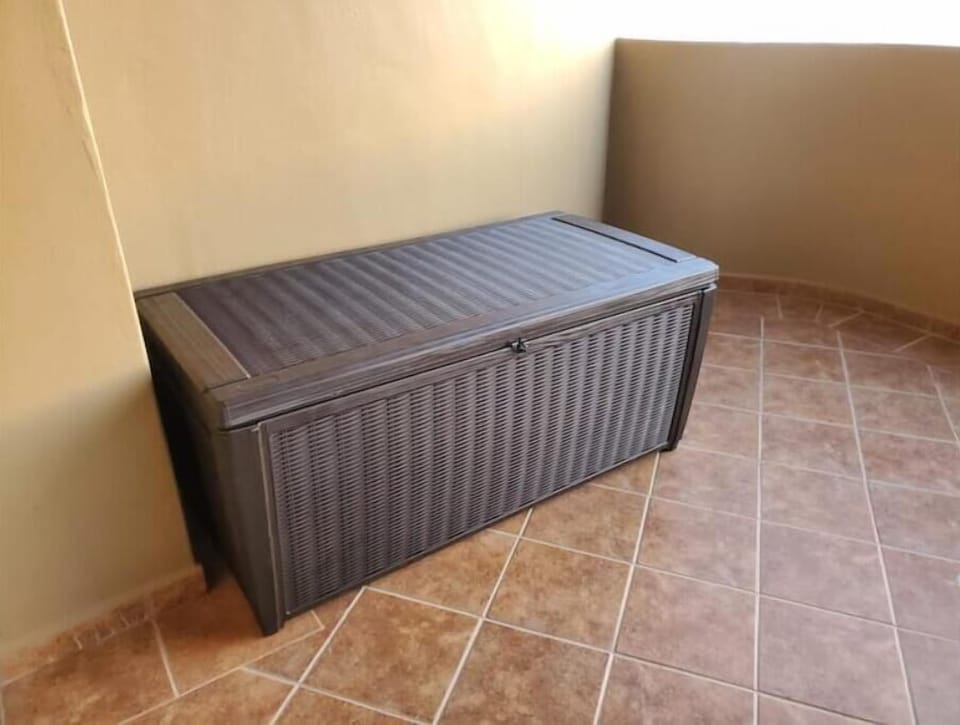Storage bin on Deck with chairs and boogie boards