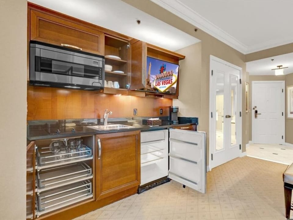 Fully stocked kitchen with sets of cookware.