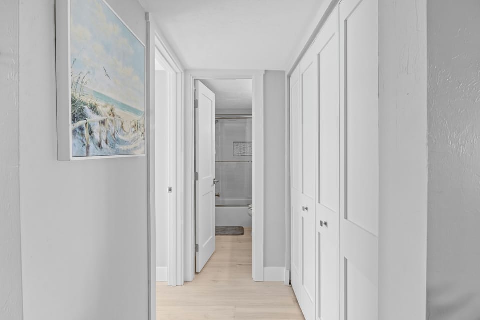 Entry to laundry closet, guest bath and bedroom from family room
